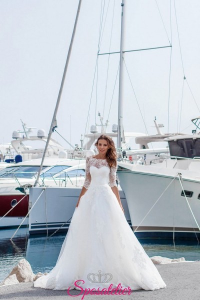 abito da sposa con maniche 3/4 di pizzo e gonna ampia