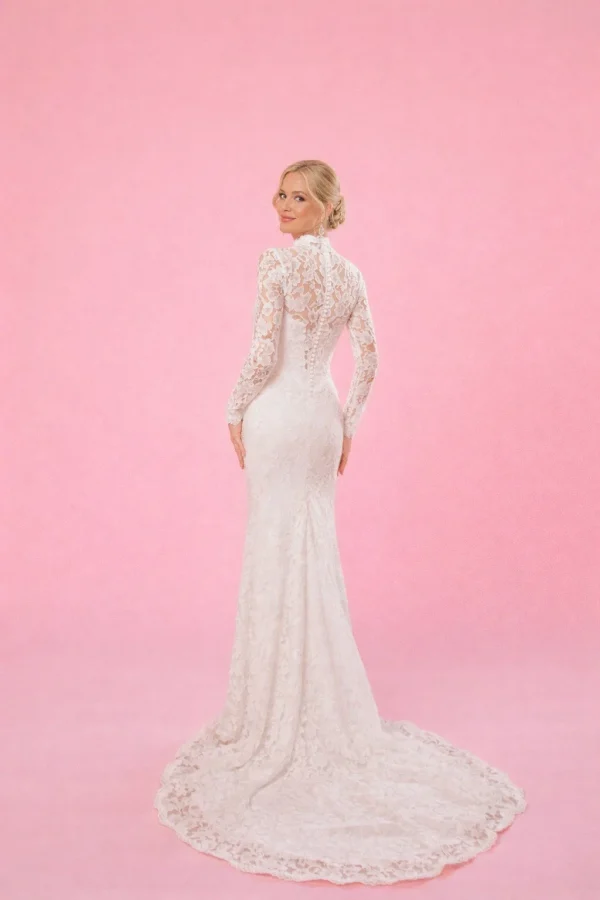 abito da sposa pizzo maniche lunghe schiena trasparente