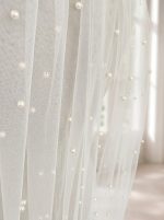 Dettaglio delle perle avorio distribuite sul tulle del velo GW-VL016