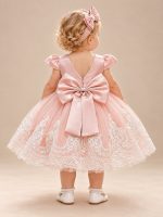 Vestito battesimo rosa con schiena a V e grande fiocco posteriore