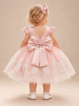Vestito battesimo rosa con schiena a V e grande fiocco posteriore