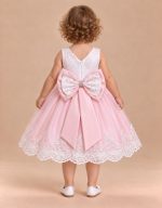 Abito battesimo rosa e bianco con maxi fiocco sul retro