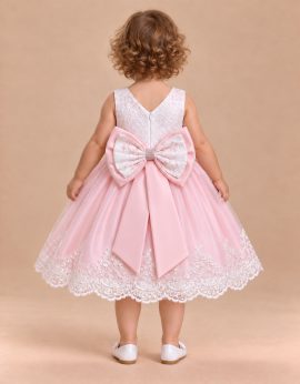 Abito battesimo rosa e bianco con maxi fiocco sul retro
