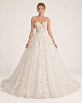 Abito da sposa principesco avorio visto frontalmente, con corsetto trasparente in pizzo floreale, scollo a cuore e ampia gonna in tulle luminoso.