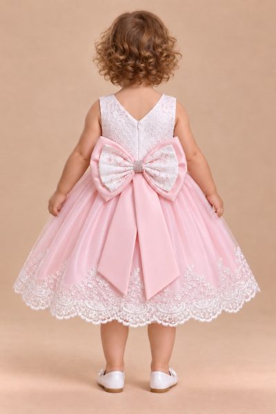 Abito battesimo rosa e bianco con maxi fiocco sul retro